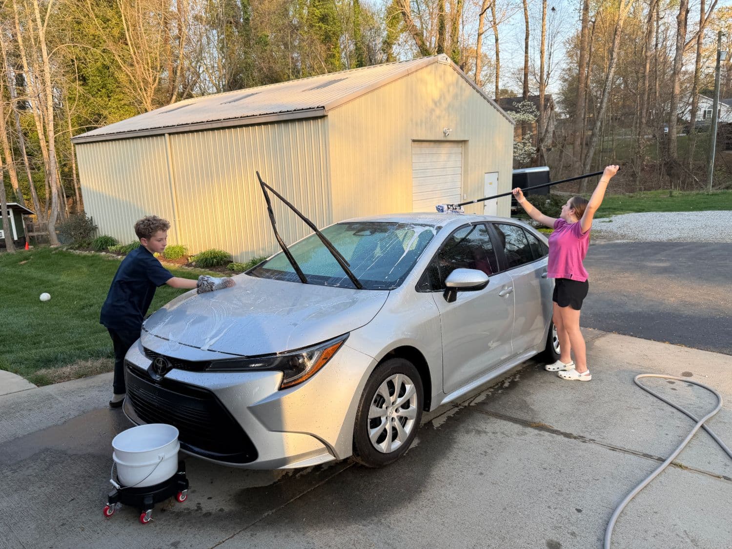 Kaitlyn washing the Toyota Corolla